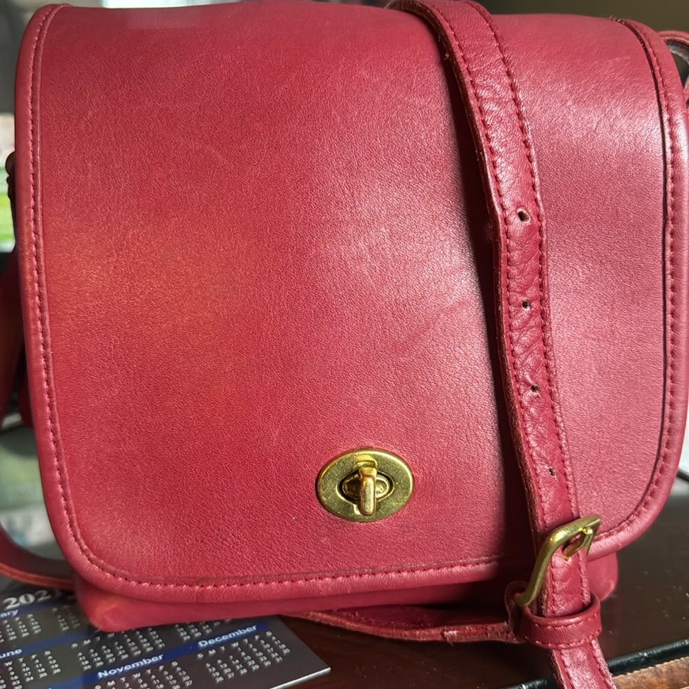 Coach 7 5/8 Vintage flap bag in mint condition wide and strap 21.5 inches long.